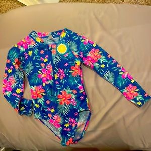 Swimwear for babies long sleeves for added protection from the sun.